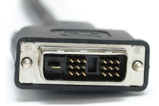 Similar to the vga in shape and has two twisting locks, the case is black and bulky, the connector has two units with three rows of three pins and to the left of one unit is another longer pin and in between the two units is a collapsed rectangle.